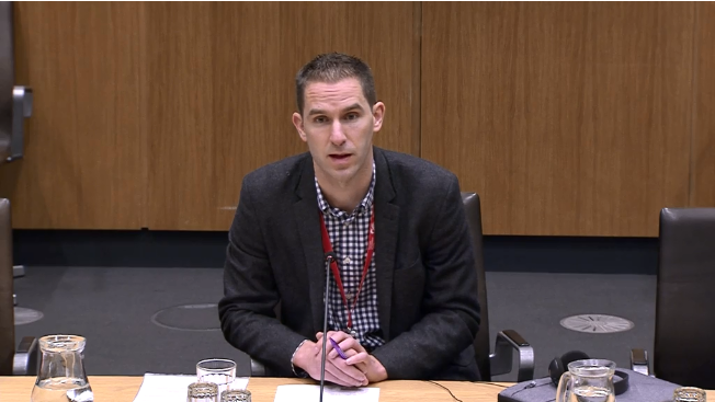 Dr Peter Mackie giving evidence at the Senedd