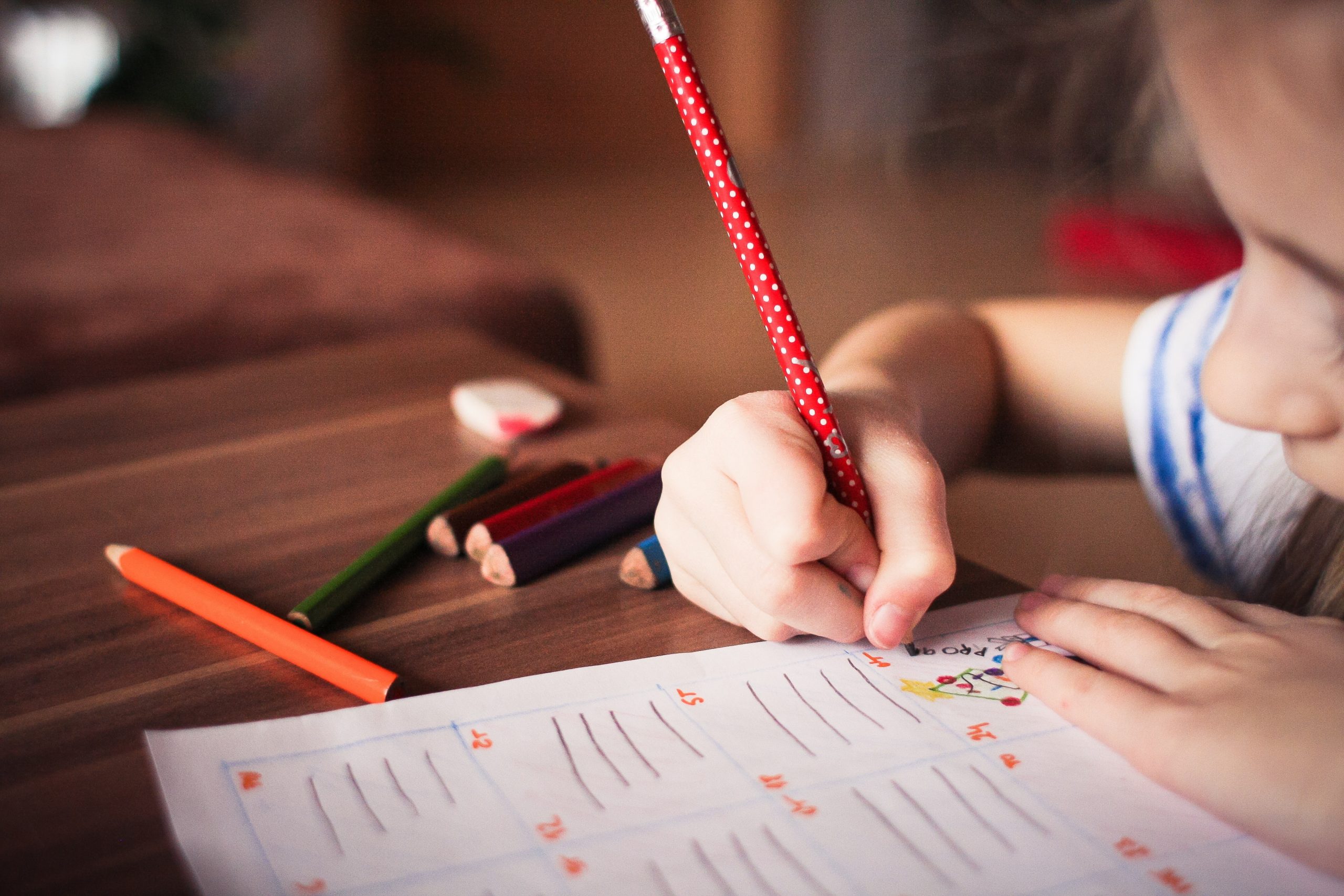 Child writing in a pencil