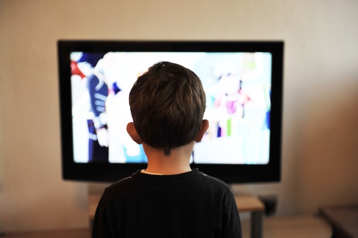 Young boy watching television