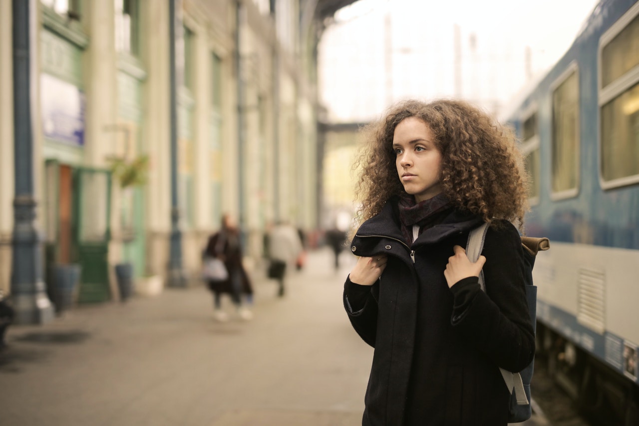Young person on a railway platform