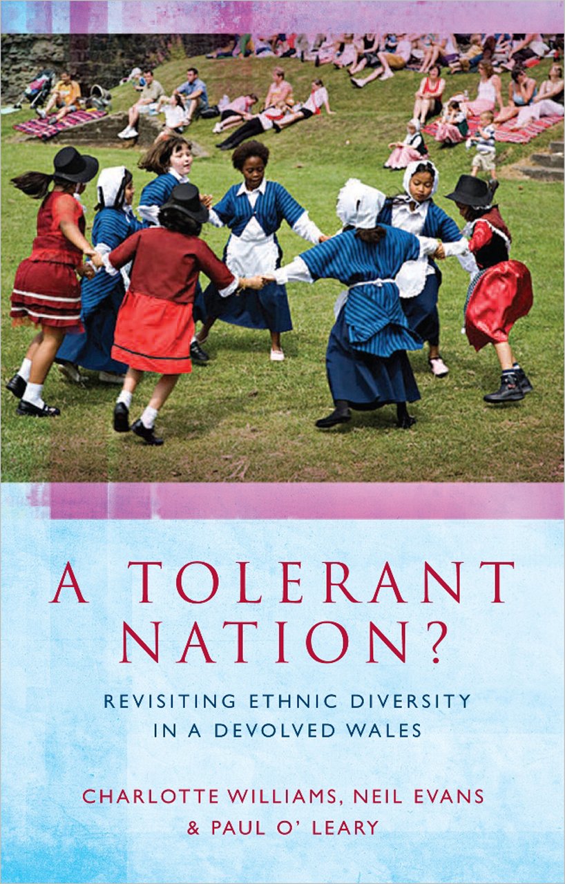 Book cover showing an ethnically diverse group oi children dancing in a circle in traditional welsh dress