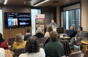 Attendees listening to a talk at the book launch for the Handbook for the Sociology of Work. Speaker. Cardiff University Emeritus Professor, Mike Reed, is at the front.