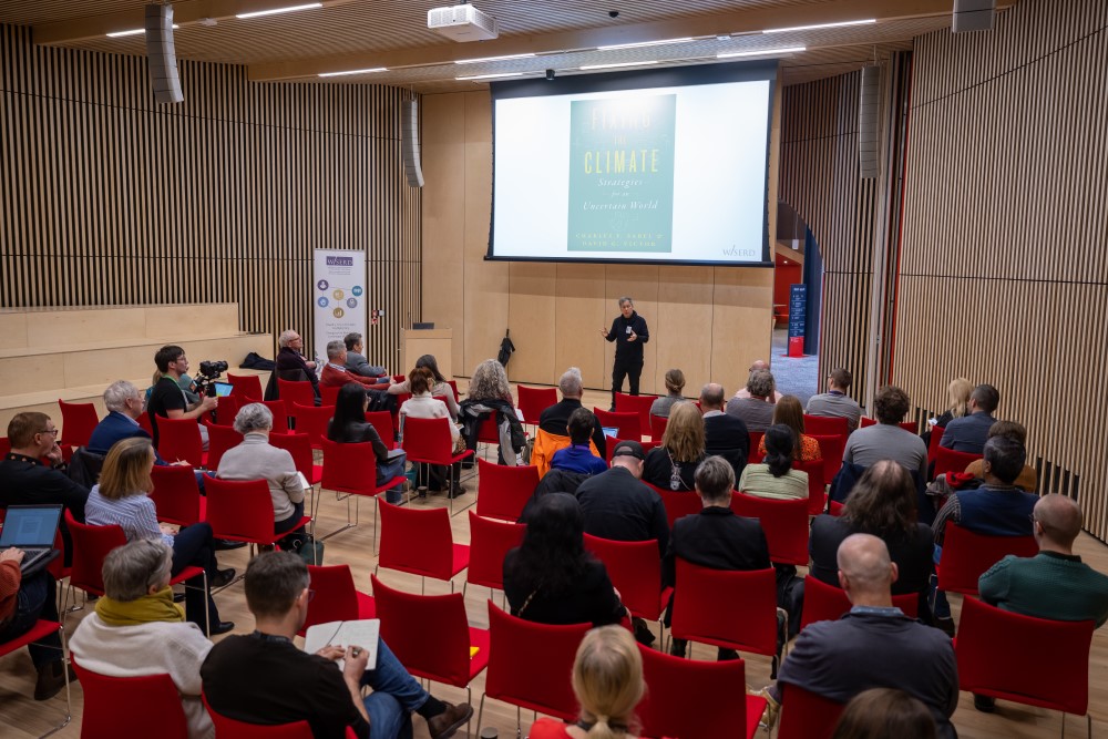 Professor Charles Sabel addressing audience in spark auditorium